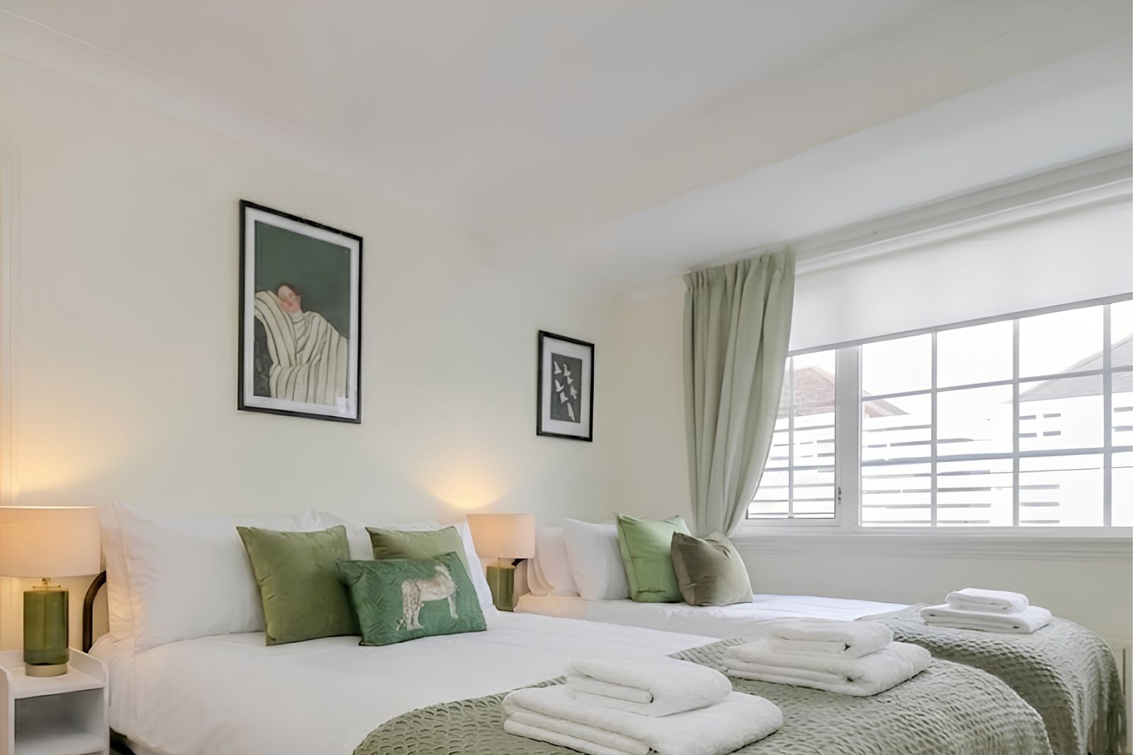Double bedroom made up with fresh linen and folded towels