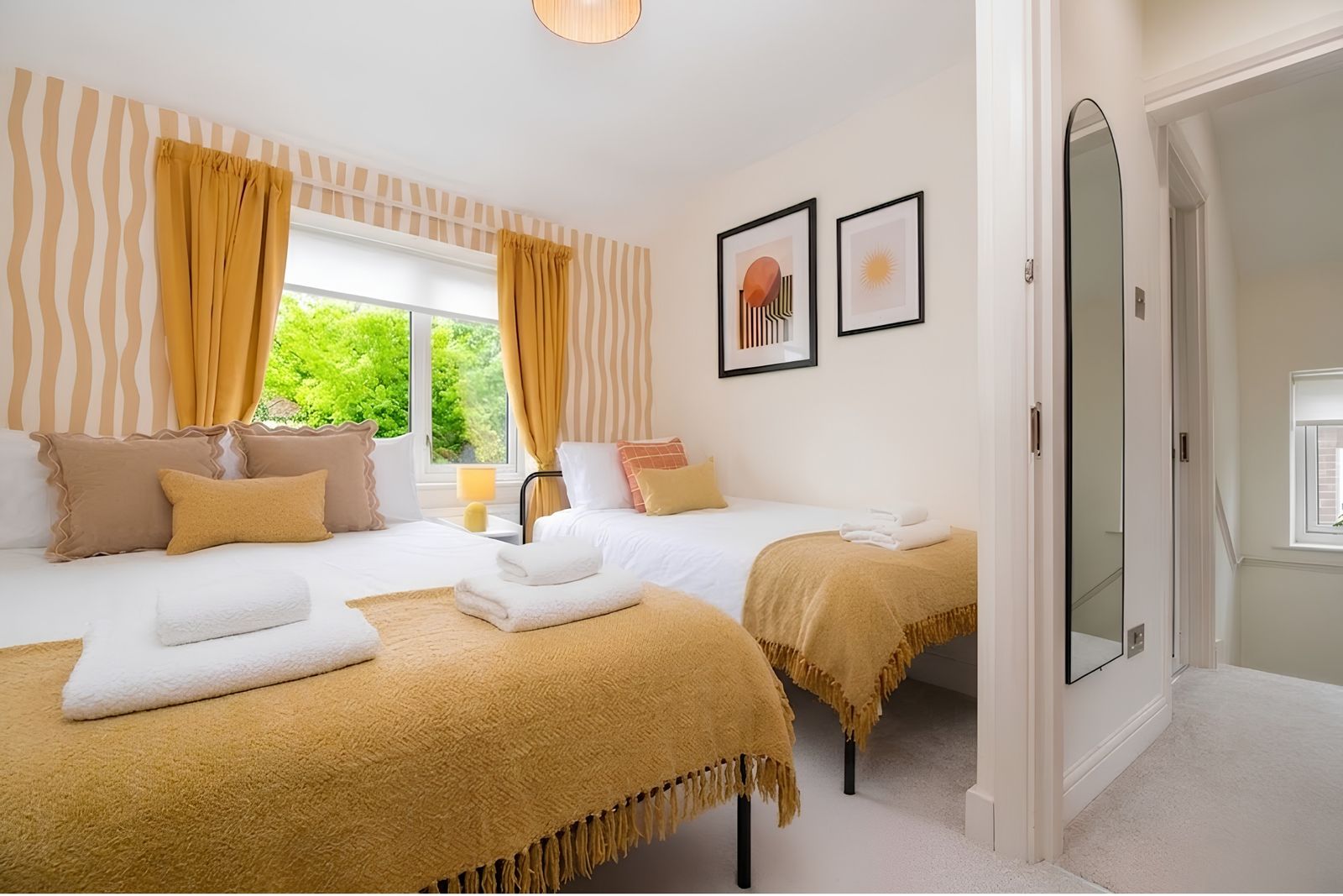 Yellow bedroom with two beds